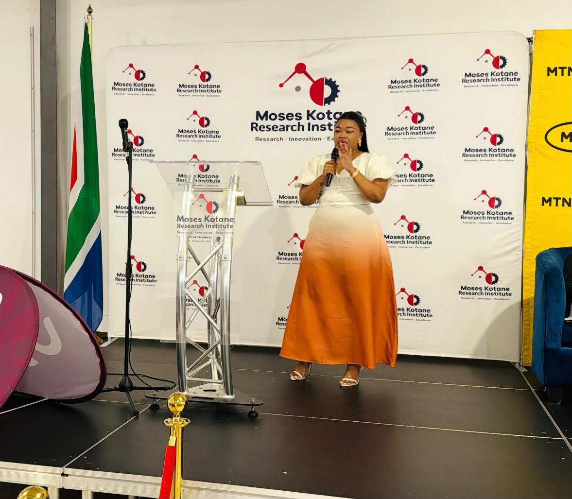 Addressing guests on stage at the Moses Kotane Research Institute